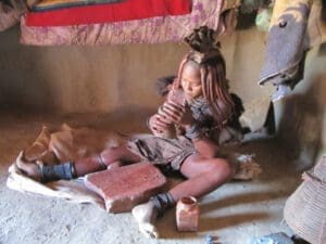 Himba lady in traditional village Namibia - Dusty Trails Safaris Namibia & Dusty Car Hire Namibia