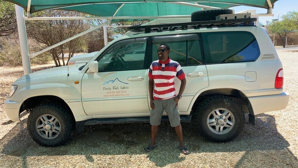 Namibian guide given in front of the land cruiser 100 series rental car - Dusty Trails Safaris Namibia & Dusty Car Hire Namibia