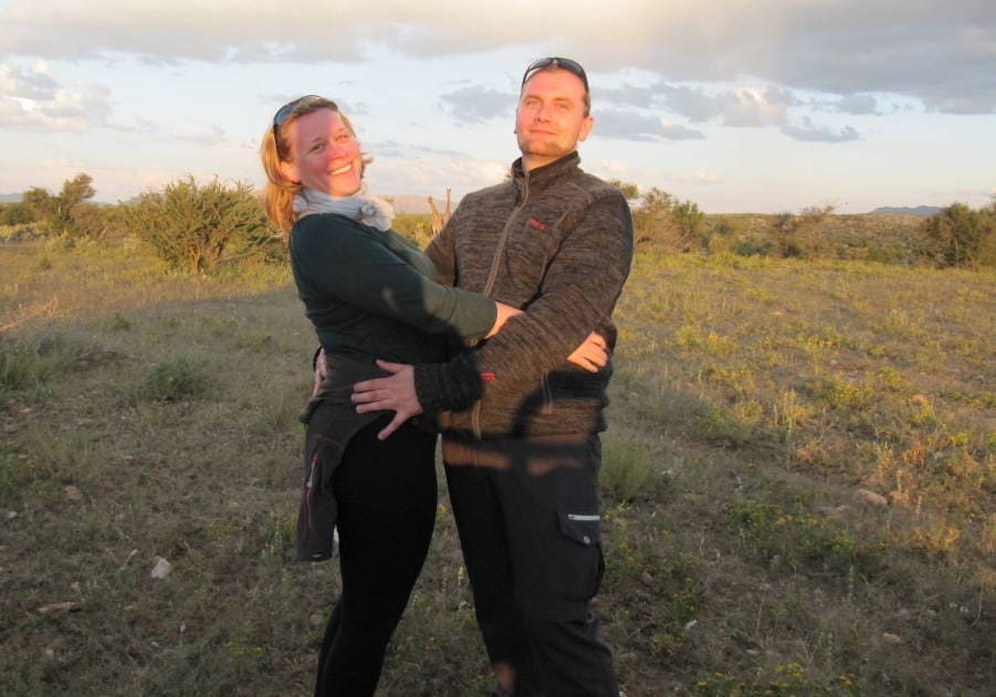 Sunna and Martin in front of two giraffes. 
Ready for the honeymoon safari to Namibia!